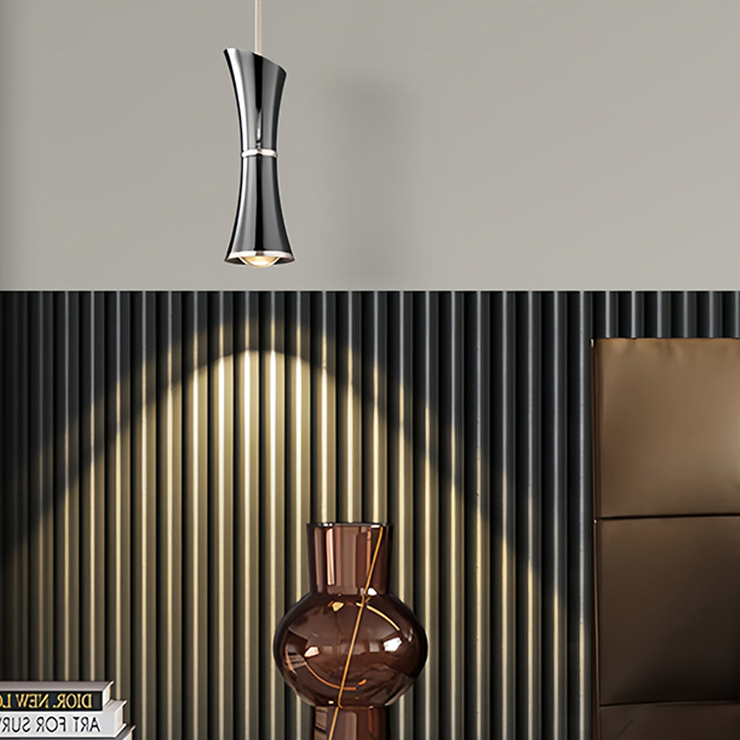 Cozy living room setup with small black pendant light providing focused task lighting