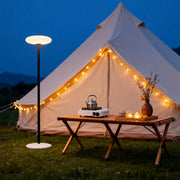 Outdoor patio floor lamp illuminating a cozy outdoor dining area, warm and inviting lighting