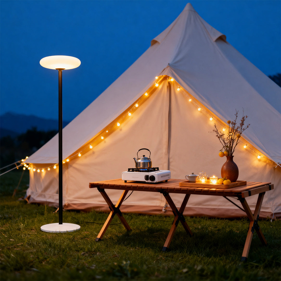 Outdoor patio floor lamp illuminating a cozy outdoor dining area, warm and inviting lighting