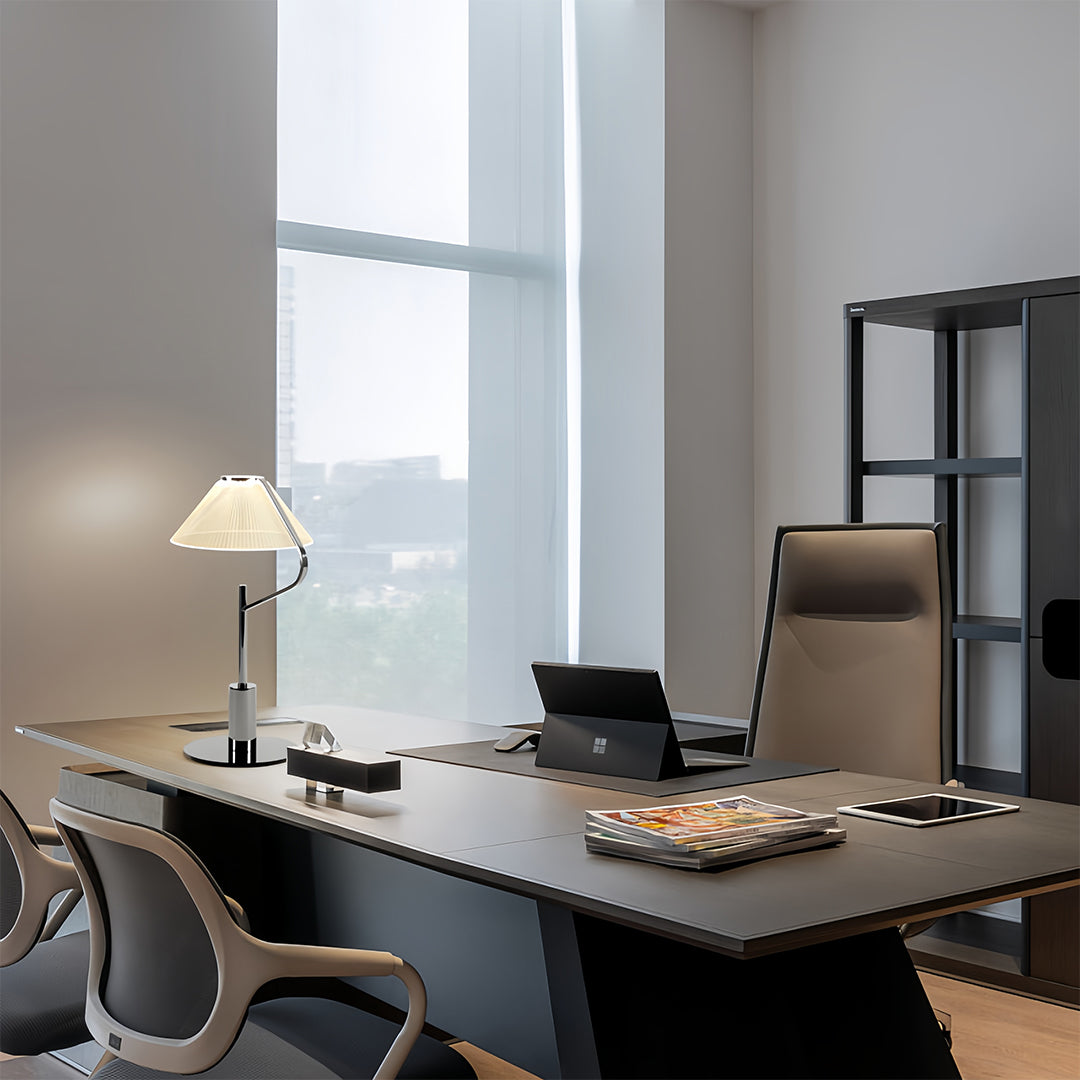 Craft floor lamp with a white fabric shade illuminating a modern office space