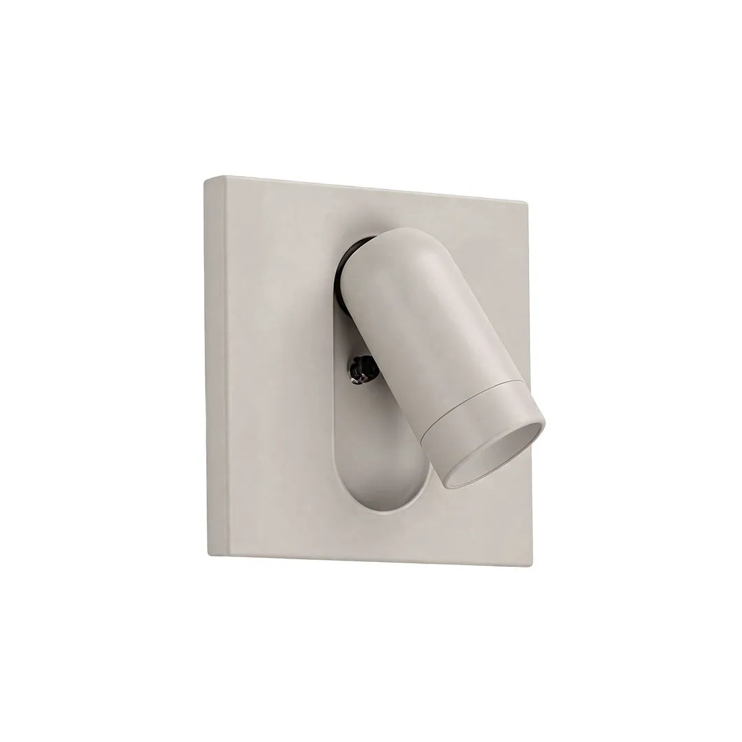 Cream wall mounted LED reading light with a cylindrical head and rectangular backplate.