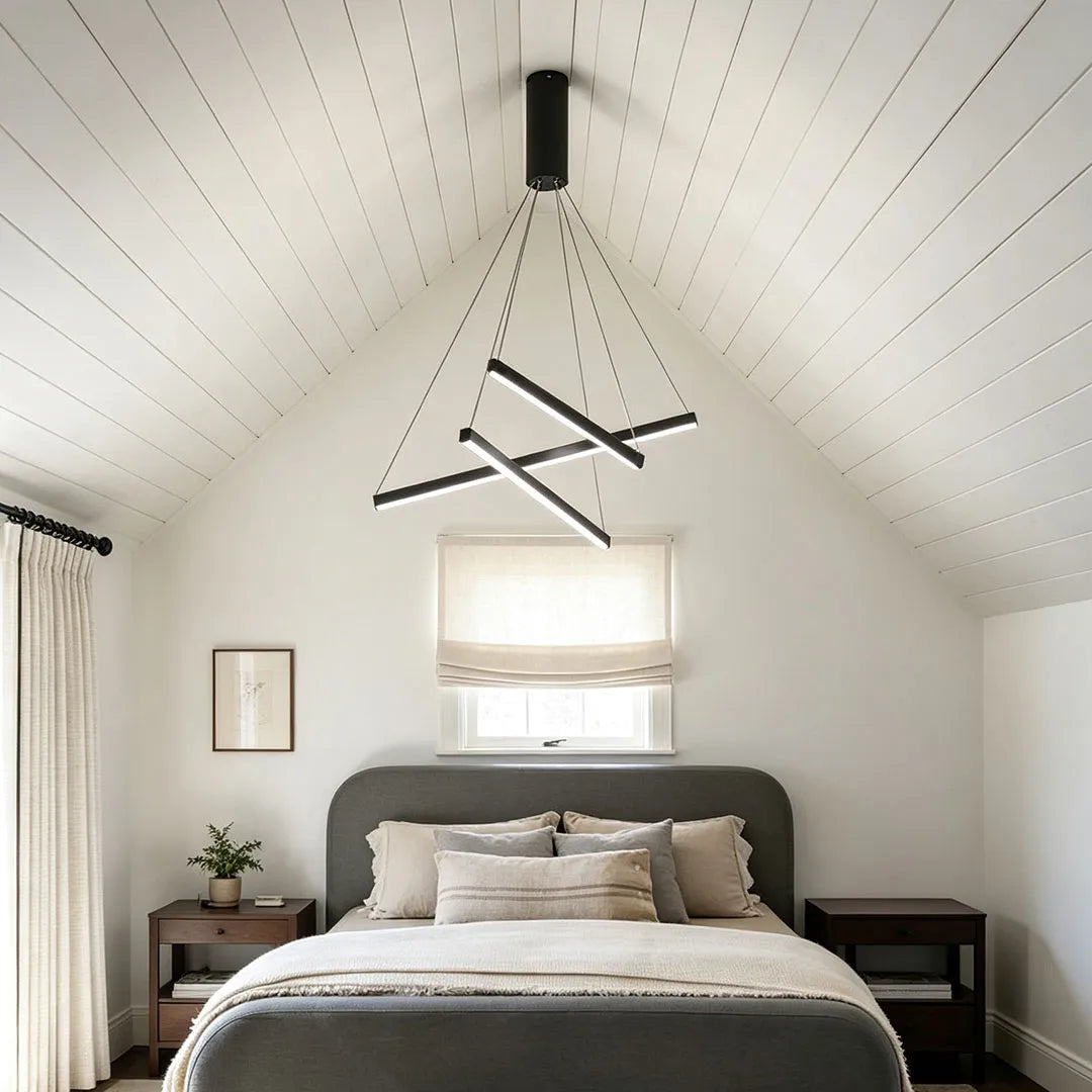 Criss linear chandelier installed in a bedroom with a minimalist crossed frame and modern ceiling design.