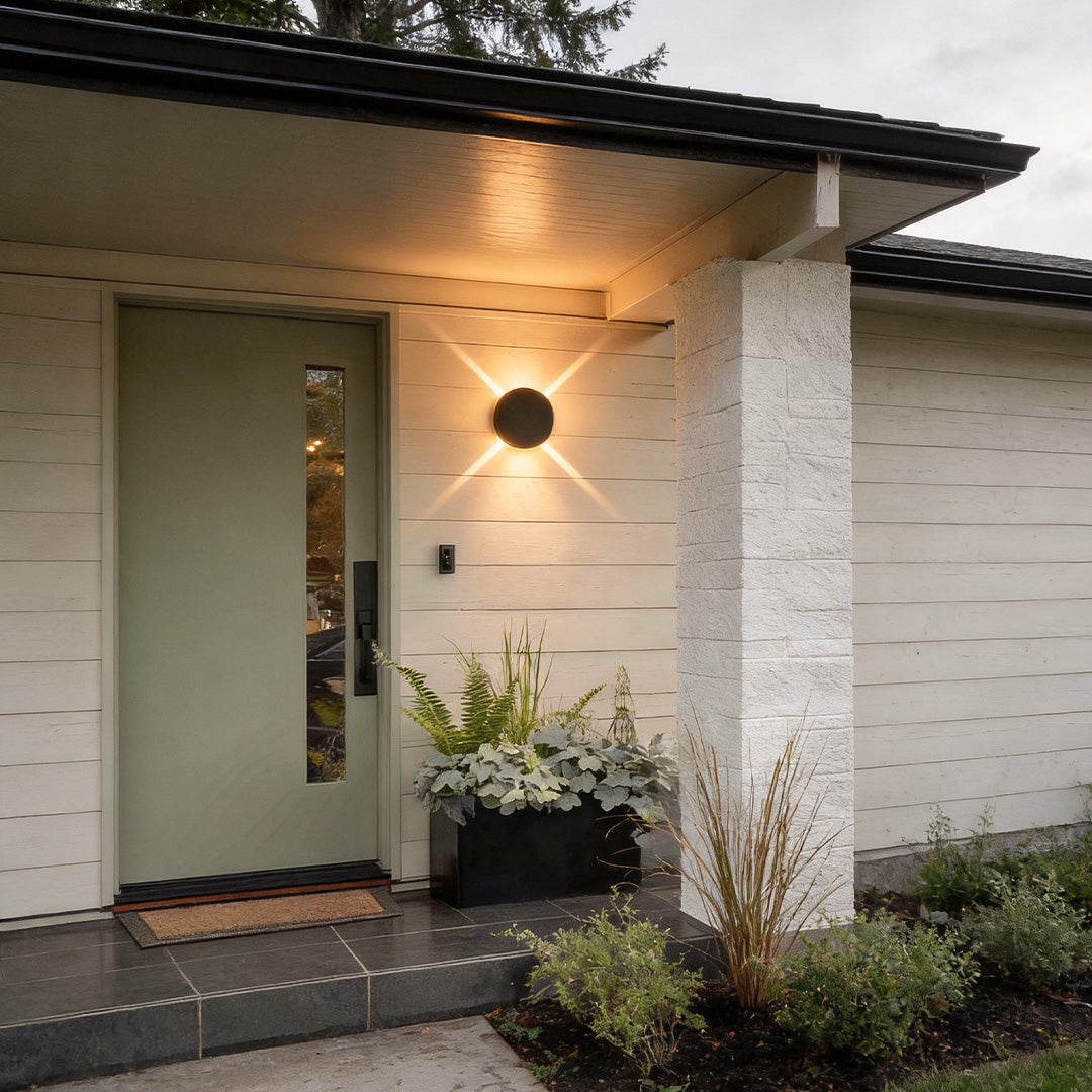 Cross light beams wall sconce enhancing a minimalist outdoor wall with sleek design.