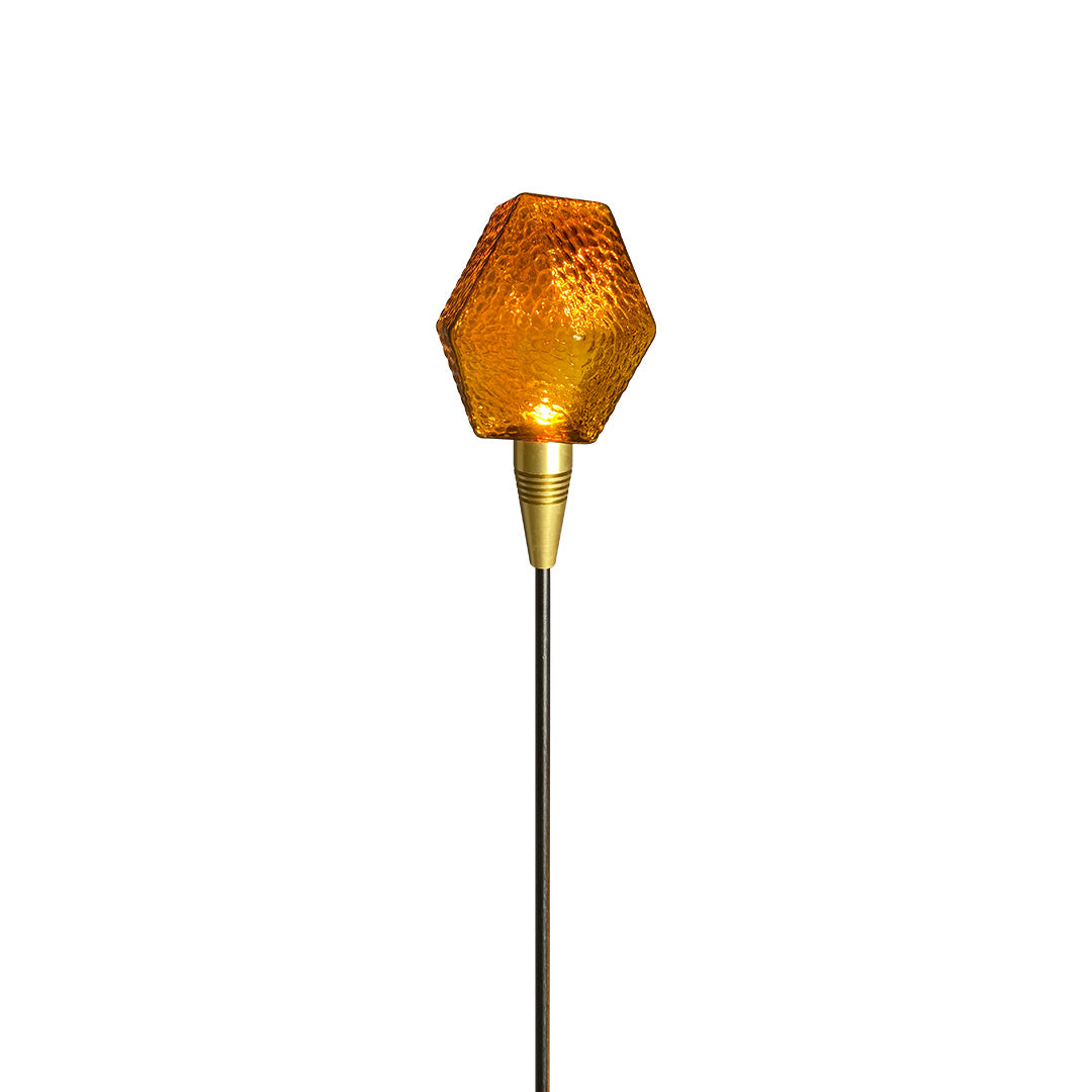 Amber crystal-textured garden globe light on a tall stake, ideal for artistic landscape lighting pathway.