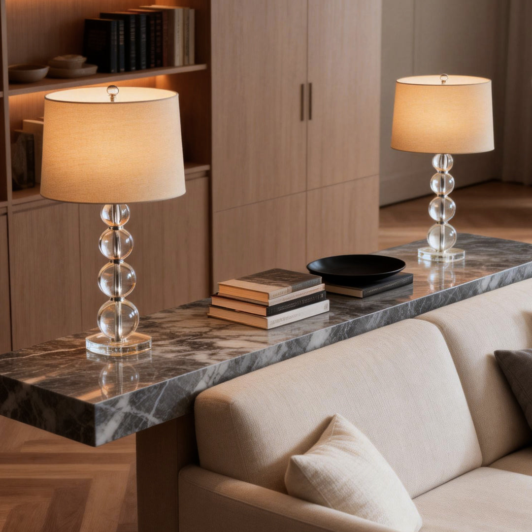 Crystal ball table lamp styled on a console table in a modern living room.