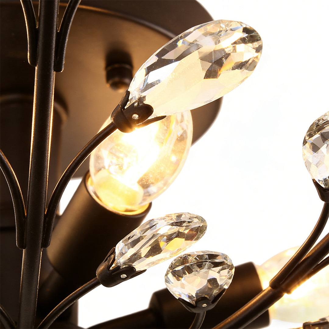 Close-up view of crystal branch chandelier illuminated crystal elements.