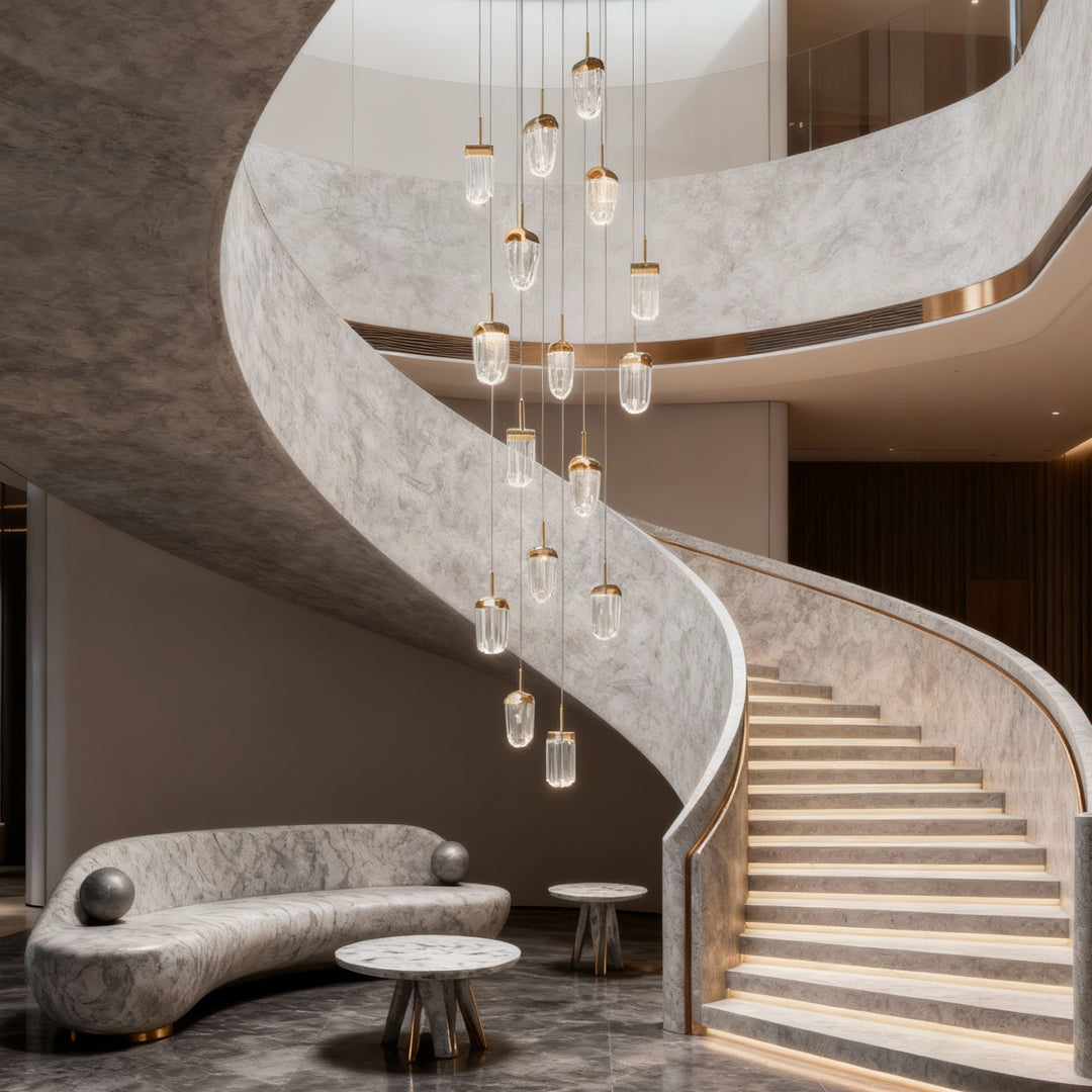 Crystal ceiling lights flush mount descending beside curved staircase in elegant entryway with sculptural seating