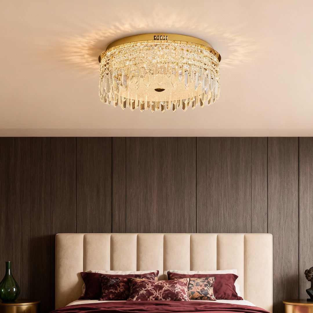 Gold crystal ceiling lights flush mount brightening a cozy bedroom interior.