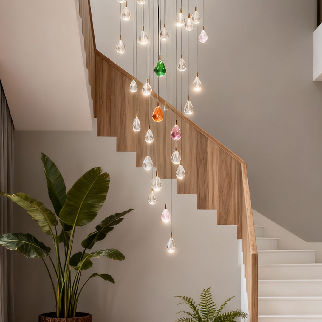 Crystal chandelier for staircase providing elegant illumination along wooden staircase in contemporary home with neutral color palette