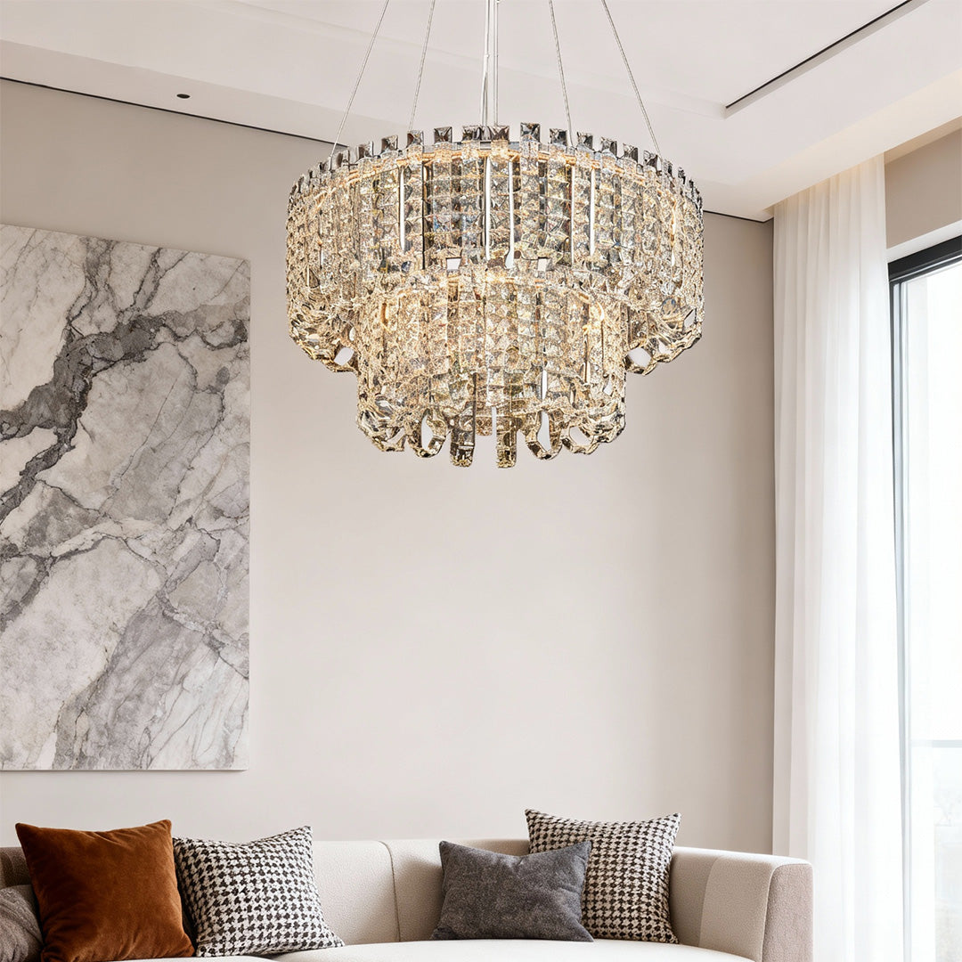 Crystal chandelier modern illuminating elegant dining space with marble accent wall.