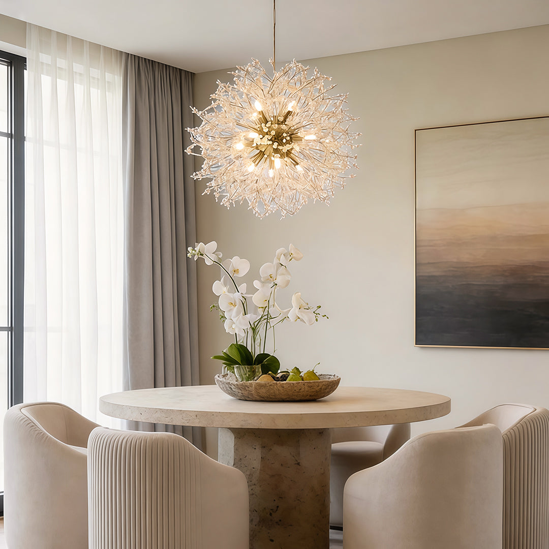 Crystal dandelion chandelier providing elegant light above a contemporary dining table.