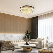 Crystal gold flush mount light illuminating stylish bedroom with beige tones and modern interior design