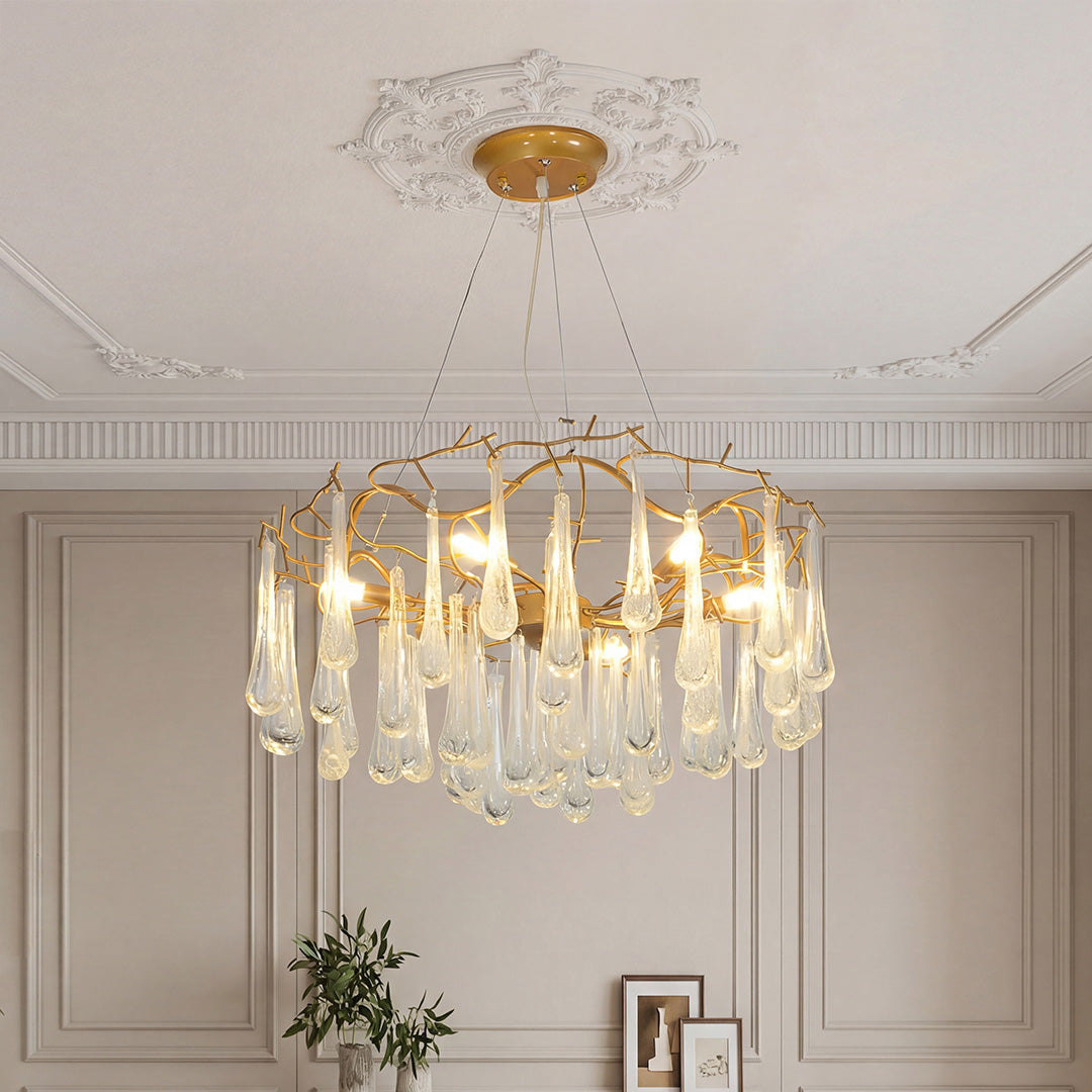 Elegant crystal modern chandelier with gold branch frame in a classic French wall room.