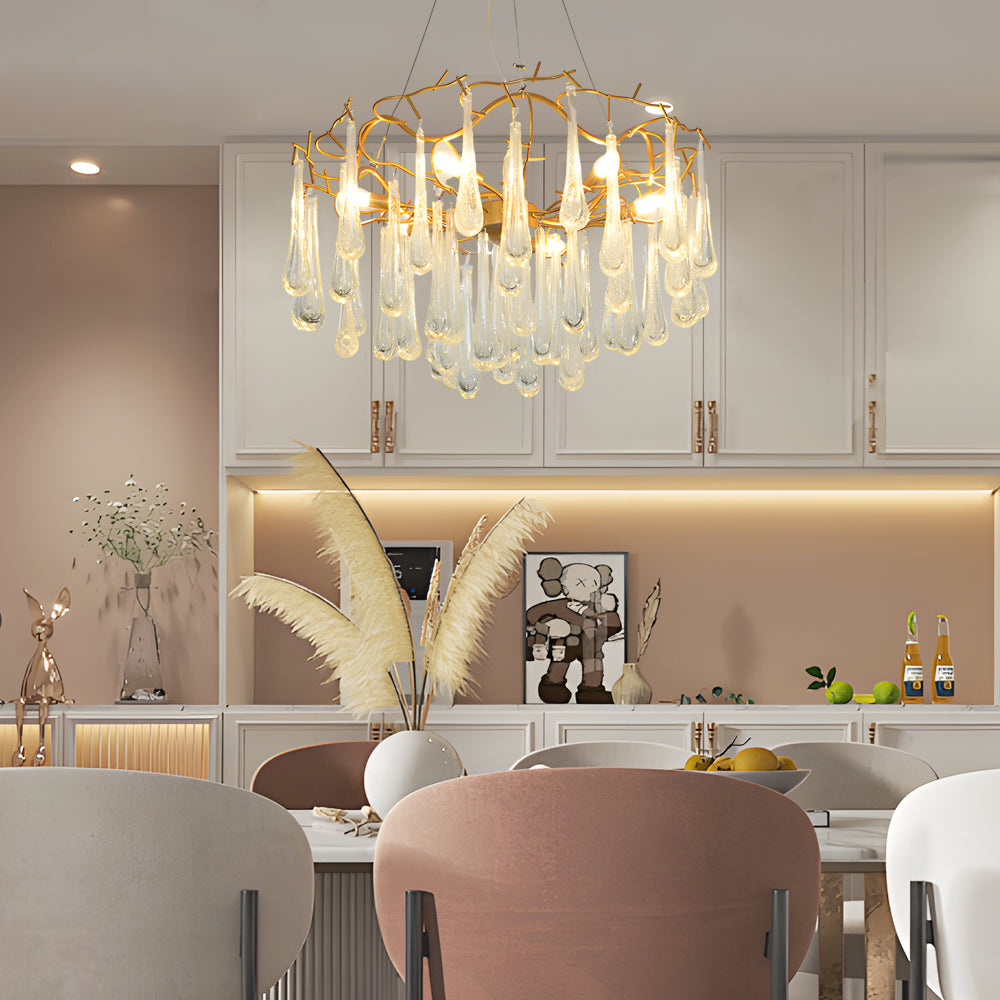 Stunning crystal modern chandelier with water drop glass in a minimalist dining space.