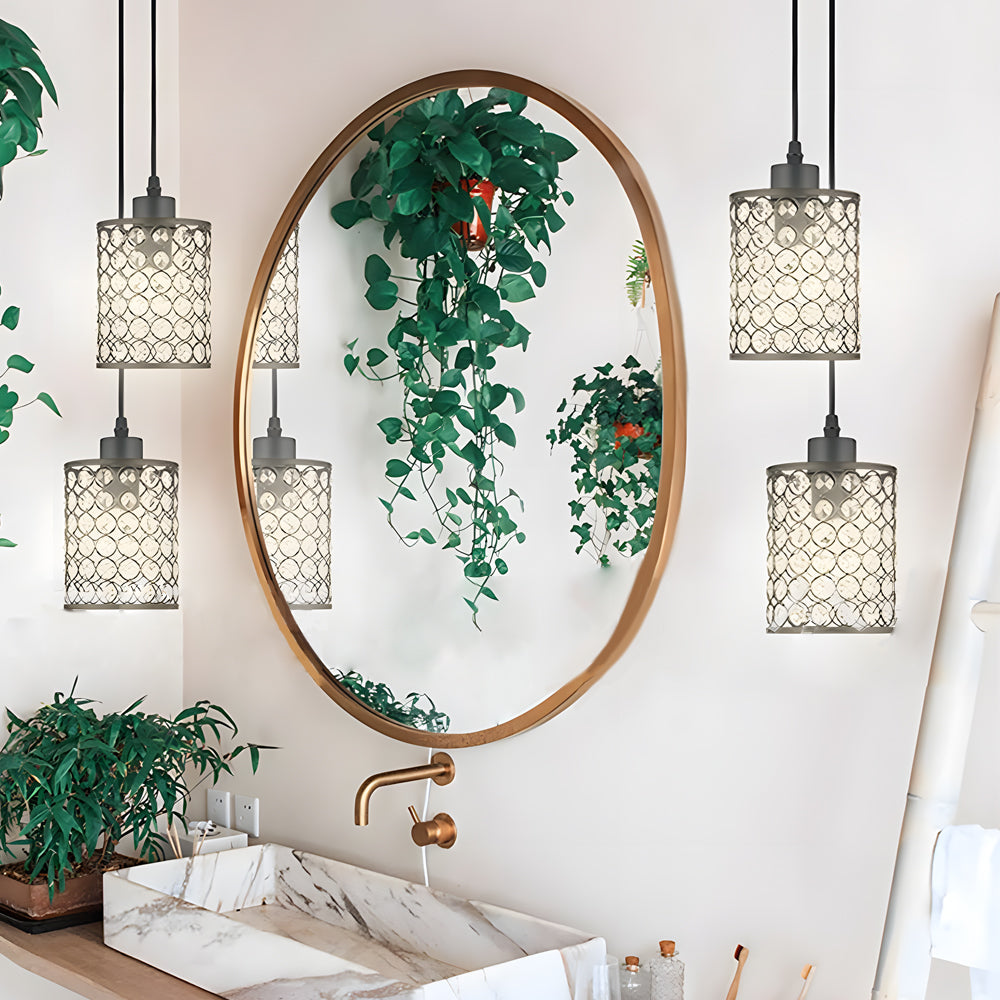 Crystal pendant lights installed in bathroom vanity area.