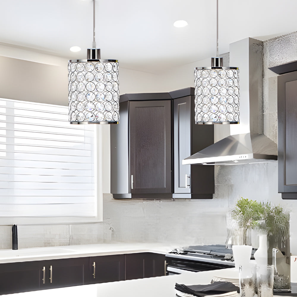 Crystal pendant lights installed above kitchen island.