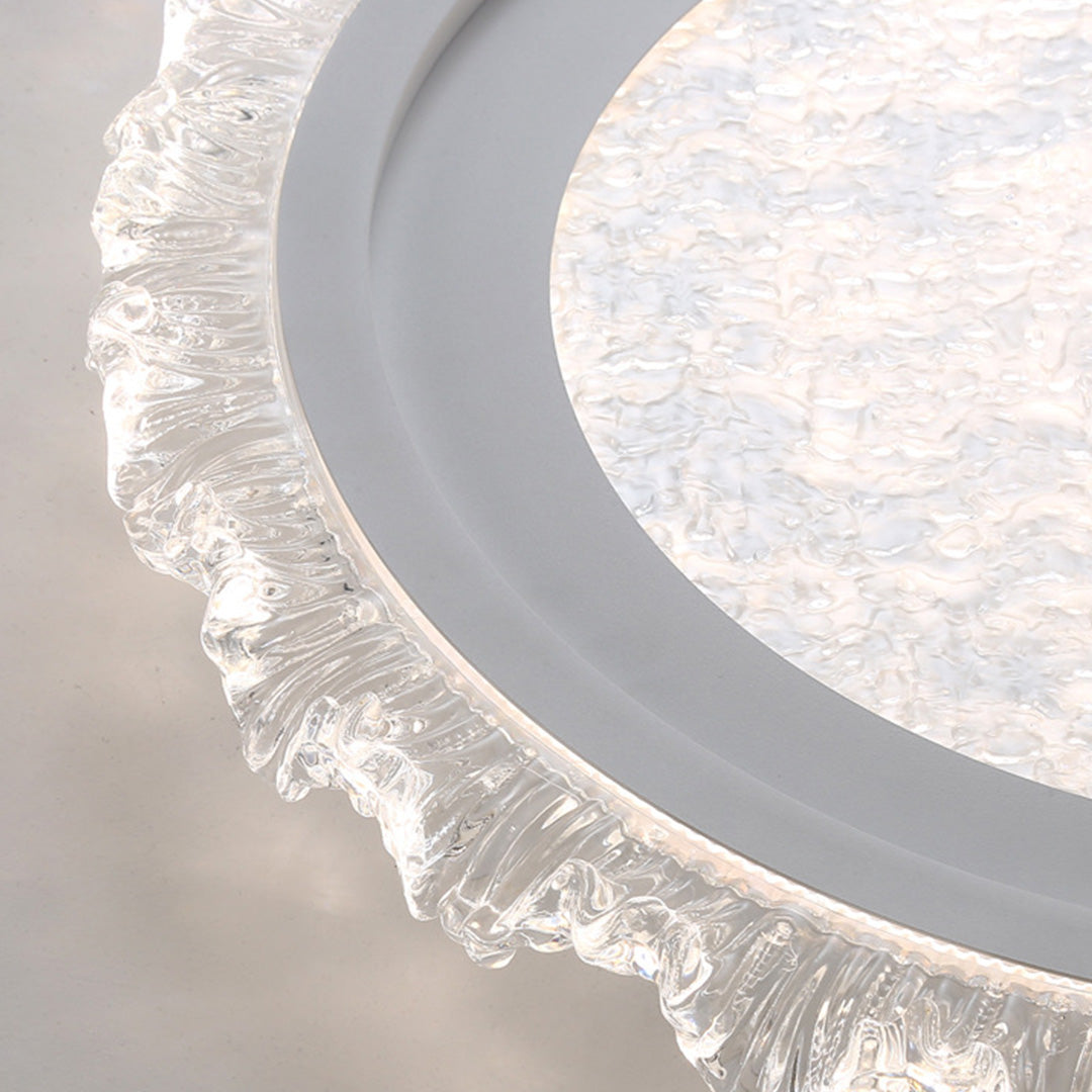 Close-up detail of crystal-rimmed glass shade chandelier showing intricate decorative edging