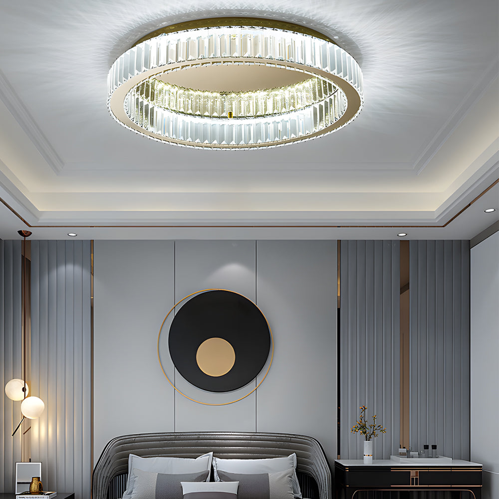 Crystal ring ceiling light in a luxury bedroom with decorative wall panels.