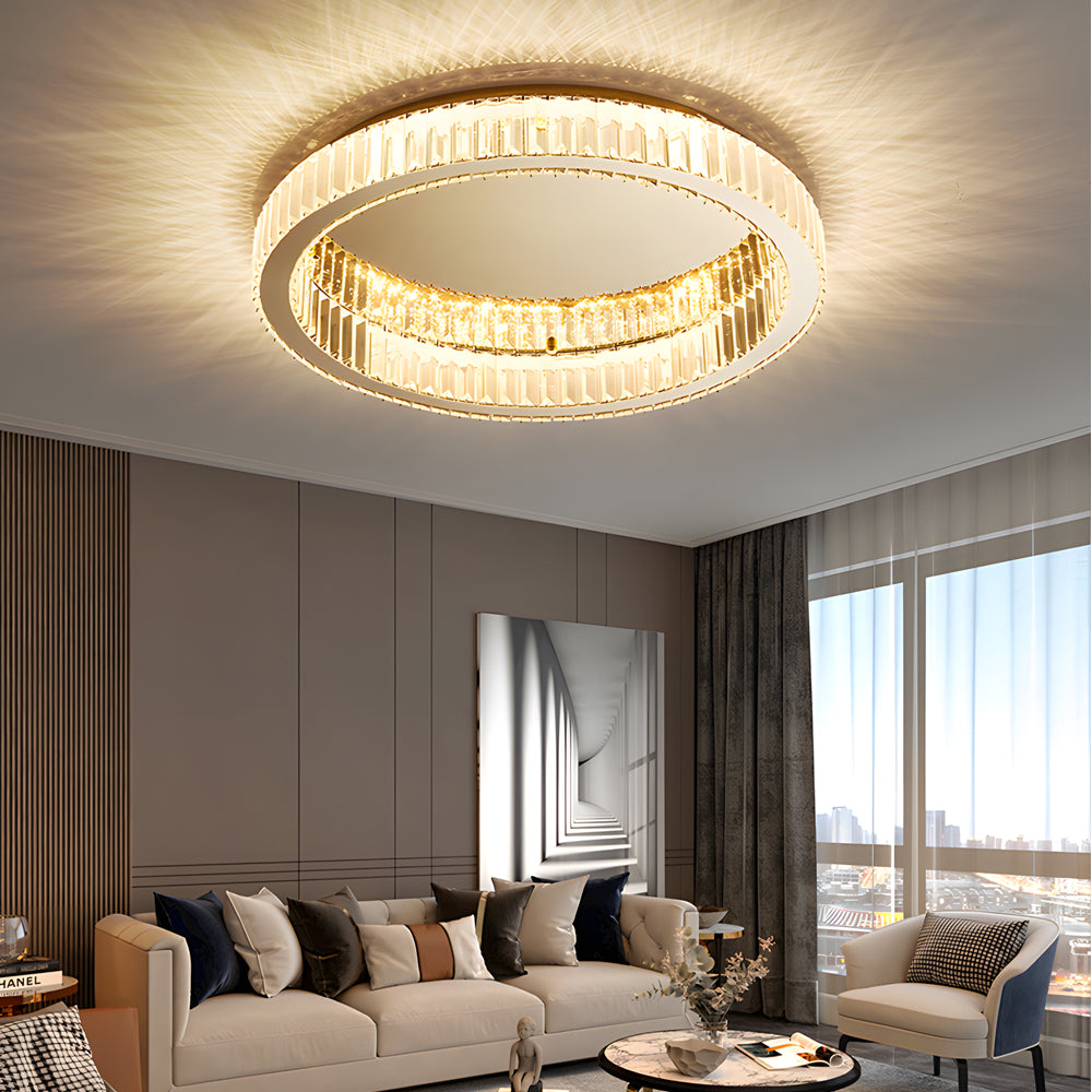 Crystal ring ceiling light casting warm light in a contemporary living space.
