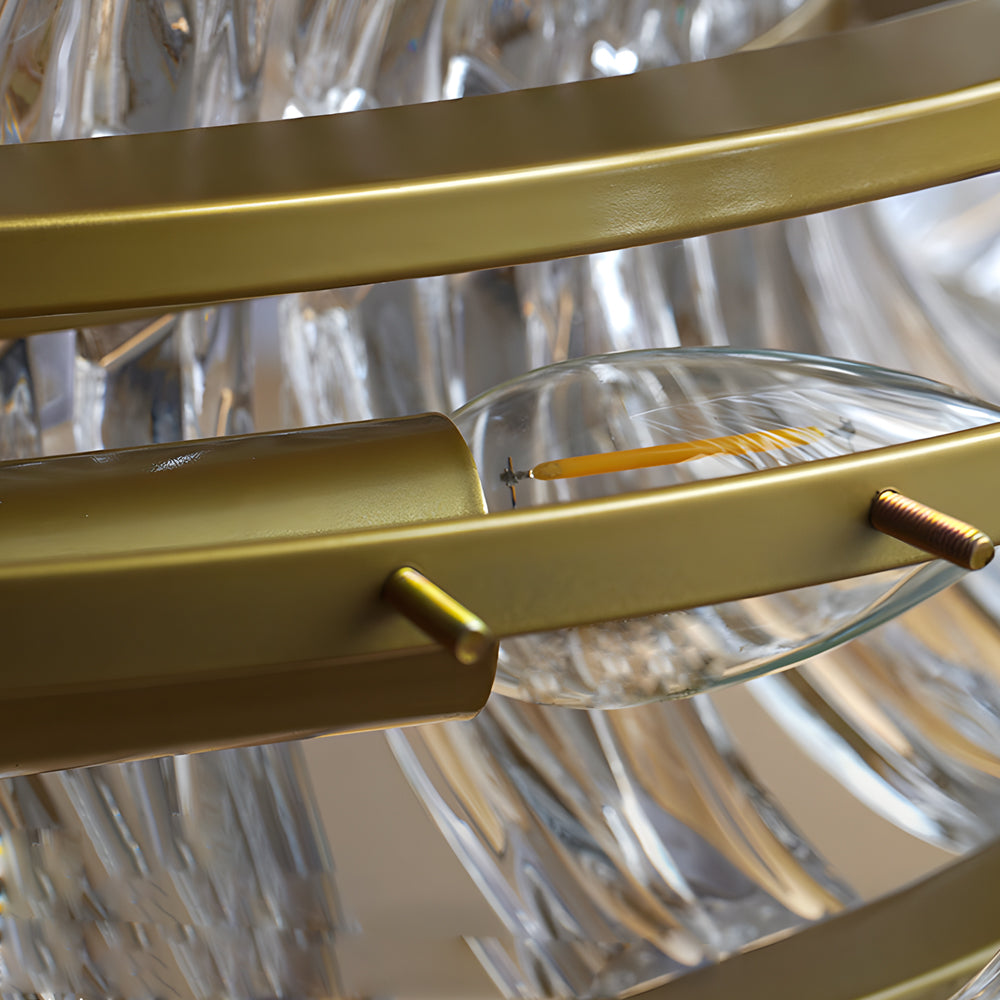 Crystal ring chandelier with a golden frame, providing ambient lighting in a contemporary space.