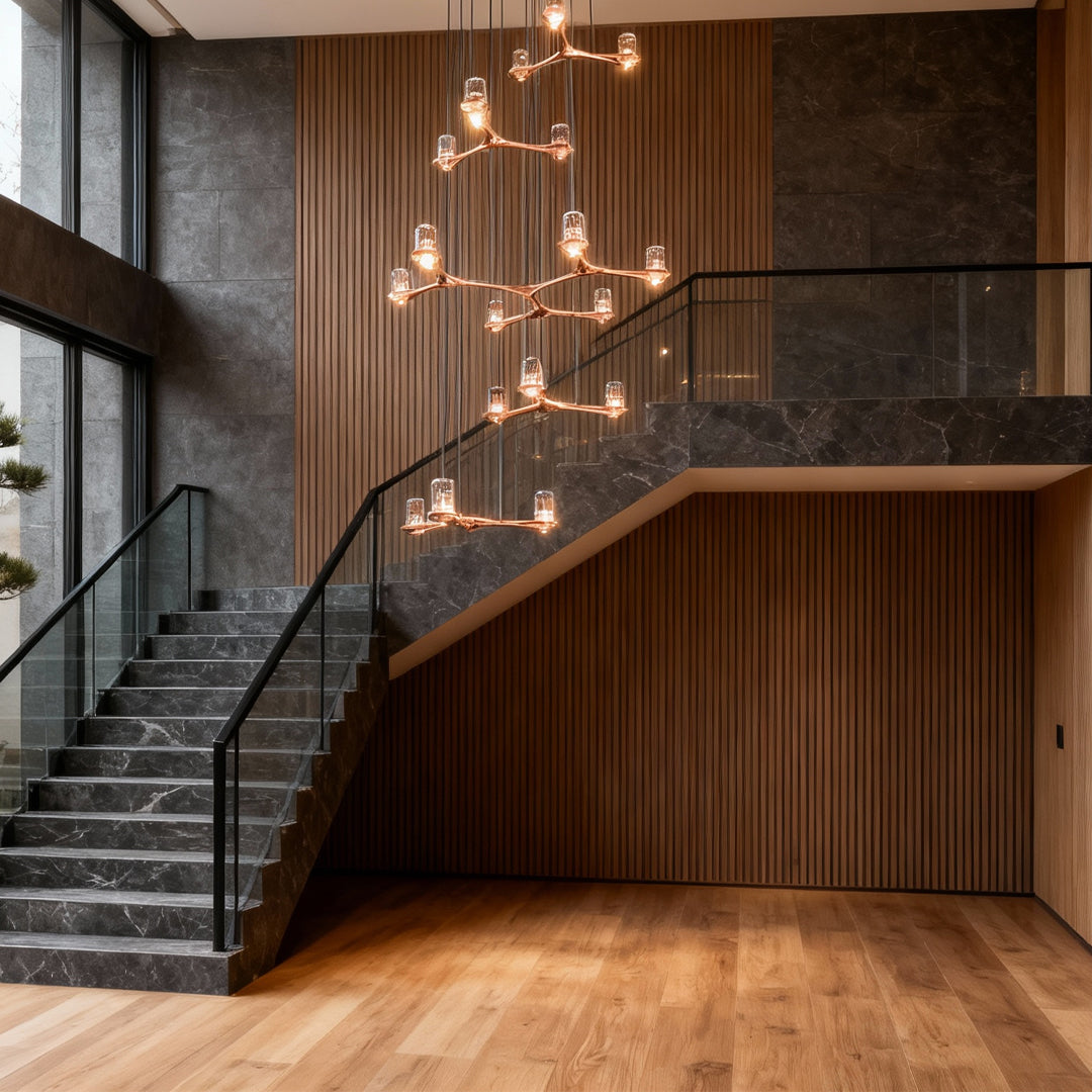 Crystal staircase chandelier illuminating luxury stairwell with wood paneling and modern architectural design elements
