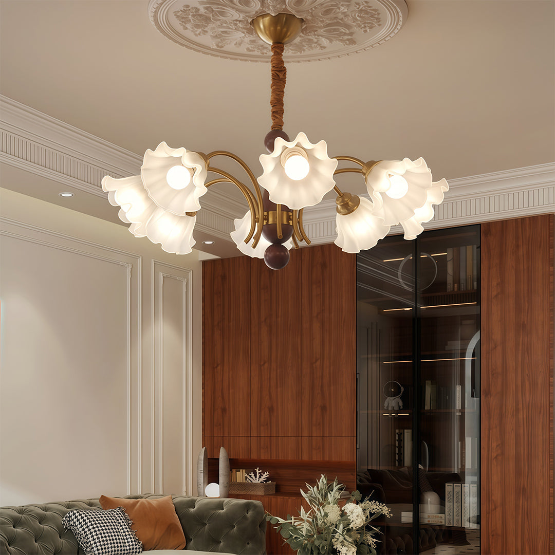 Crystal vintage chandelier creating ambient lighting in dark contemporary room with brown walls and modern furniture.