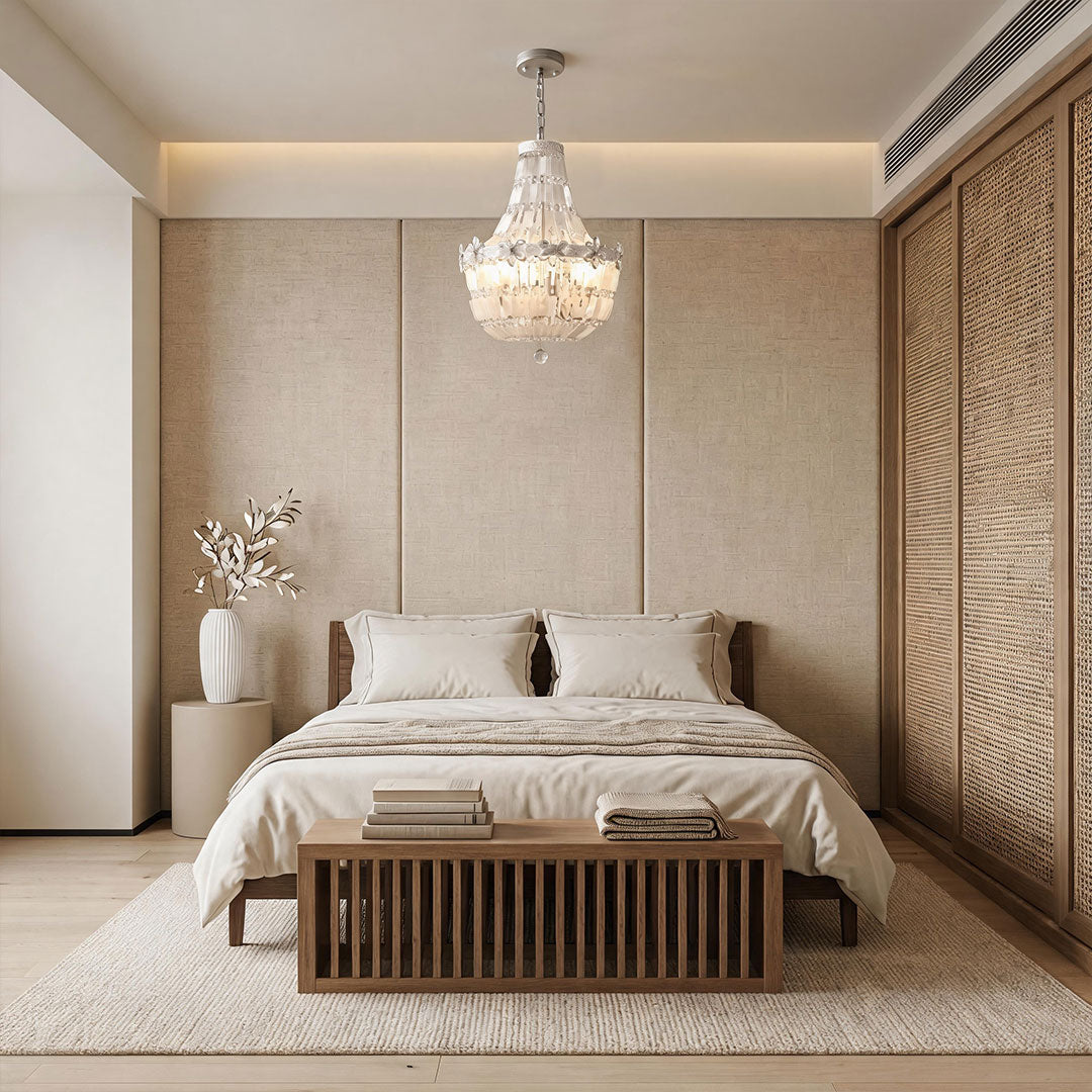 Crystal vintage chandelier creating a luxurious focal point above a contemporary bedroom.