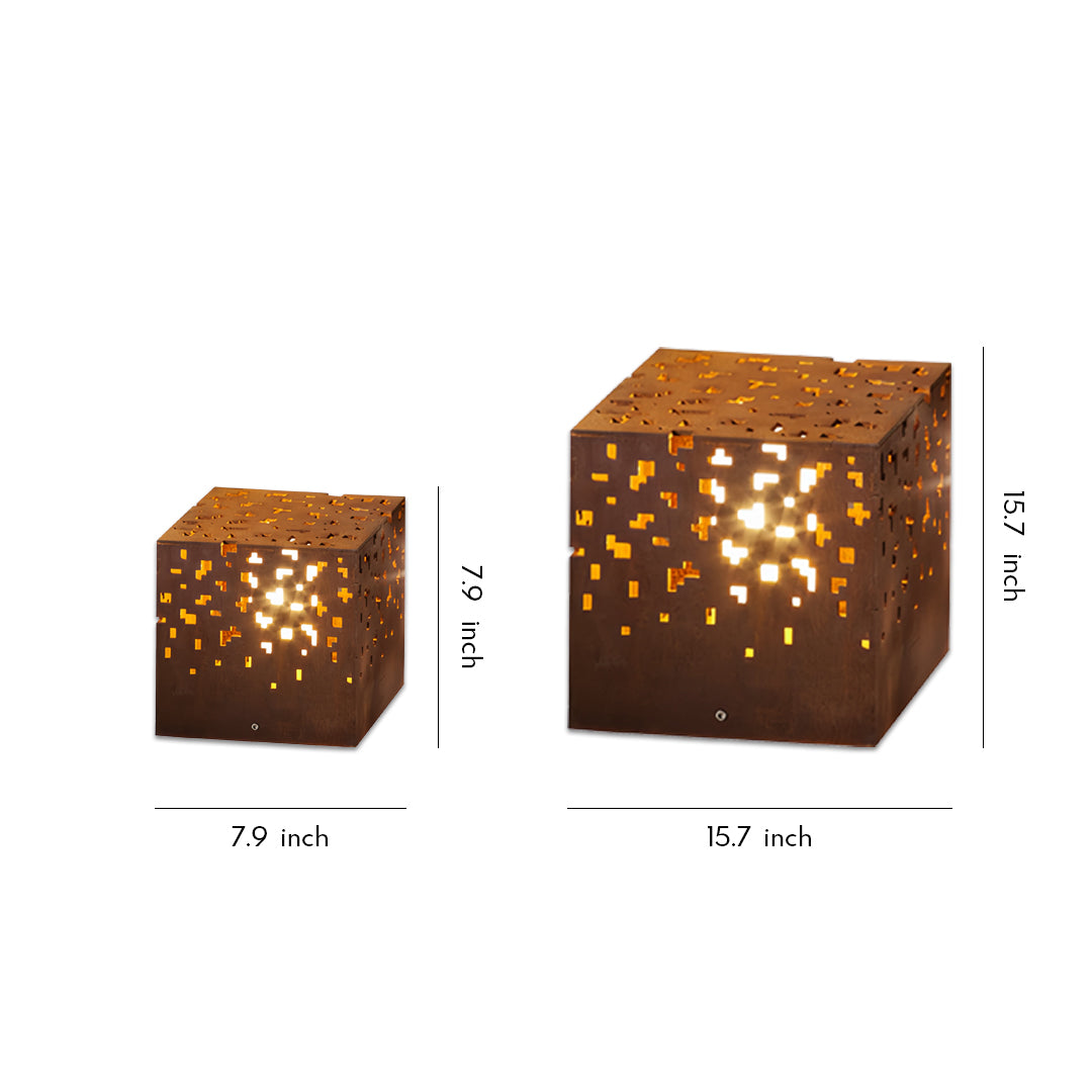 Modern cube-shaped black outdoor lantern lights with perforated patterns casting warm decorative glow.