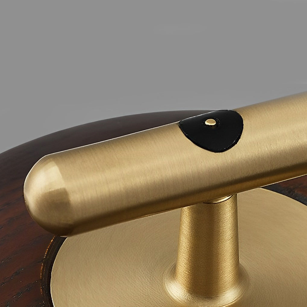 Close-up of a cup glass table lamp, showcasing its gold handle and intricate glass design.