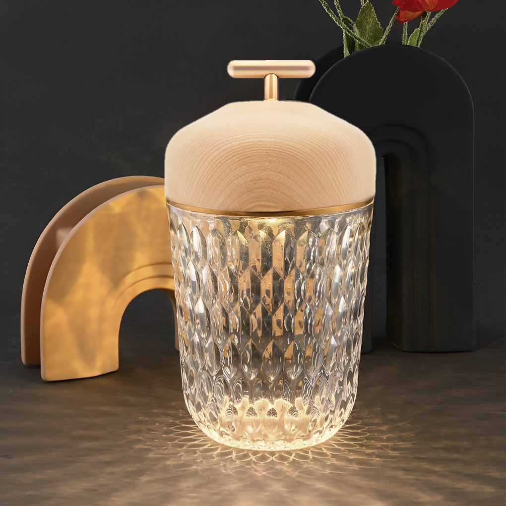 Stylish cup glass table lamp with a wooden top, casting a soft light on a dark coffee table.