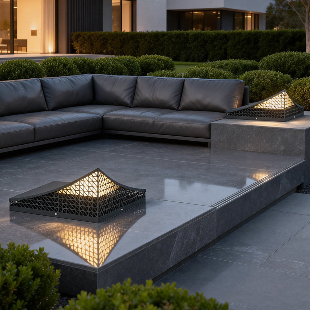 Curved landscape light enhancing a contemporary patio with subtle lighting.