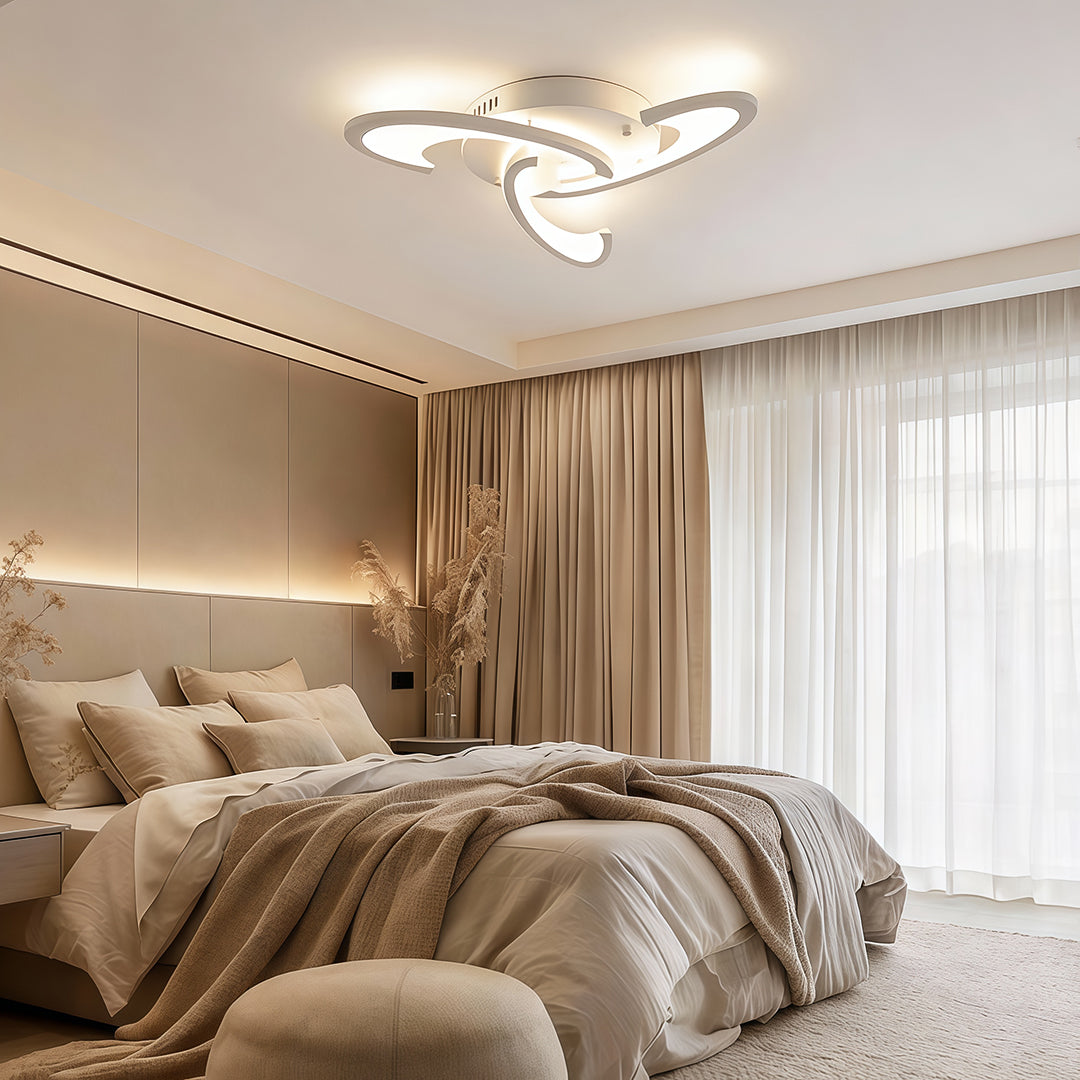 Curved LED ceiling light in a contemporary bedroom with warm white illumination.