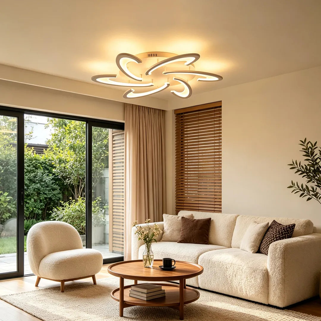 Curved LED ceiling light with petal-like loops adding soft illumination to a cozy modern sitting room.