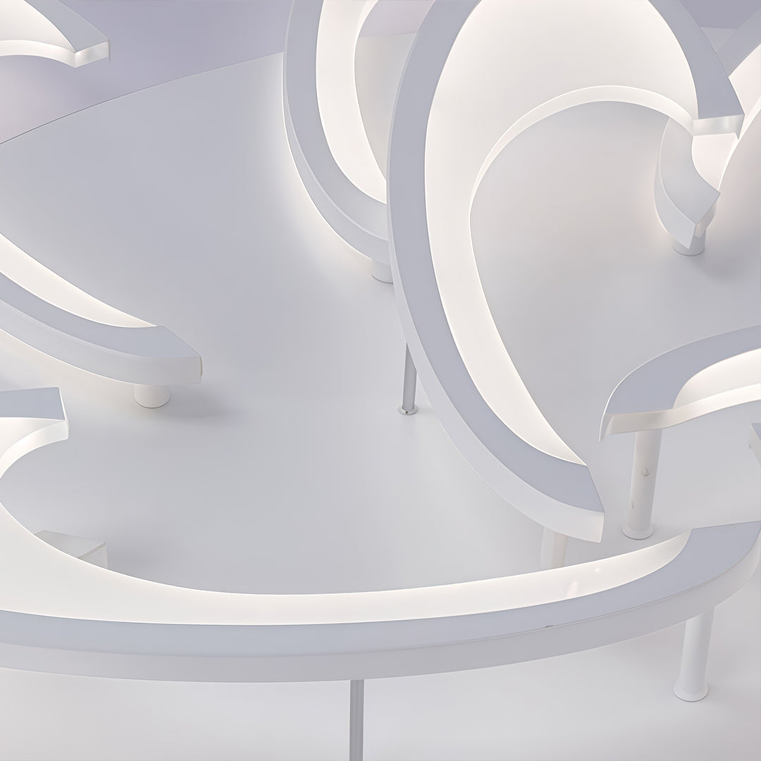 Side view of curved LED ceiling light showing smooth flowing lines.