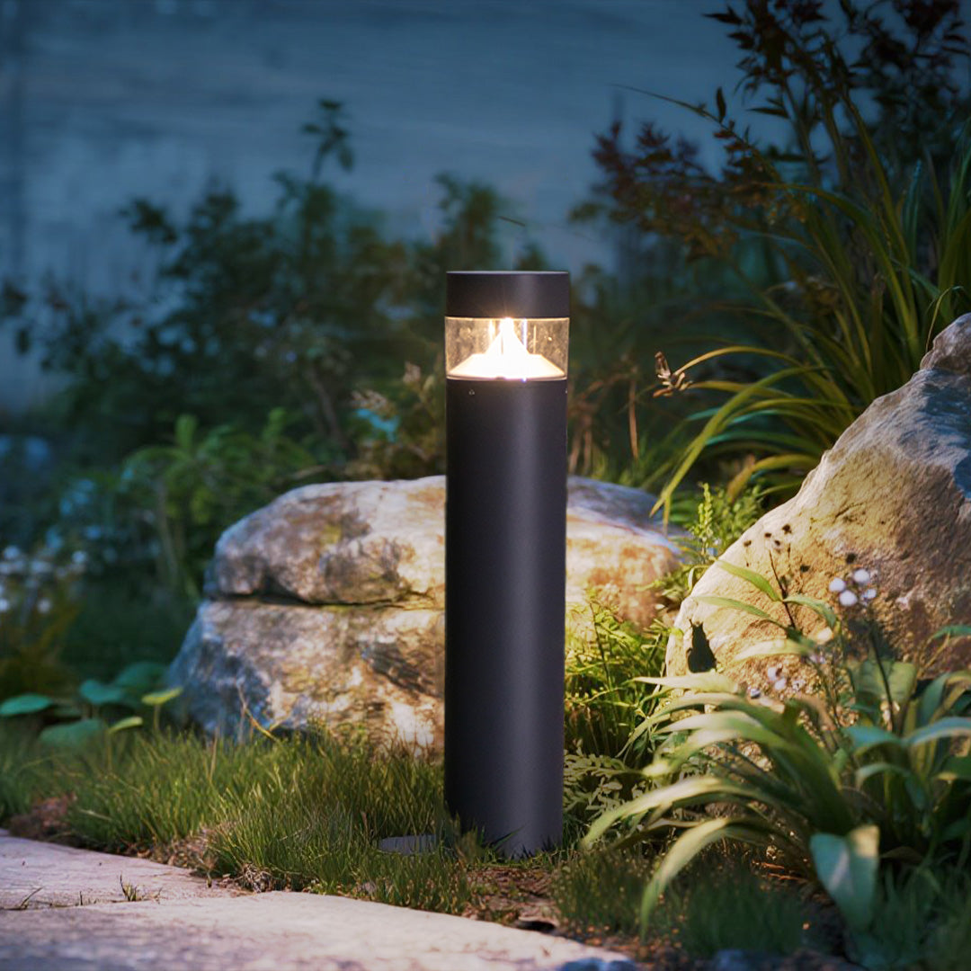 Cylindrical pathway lights creating guidance illumination along curved residential roadway