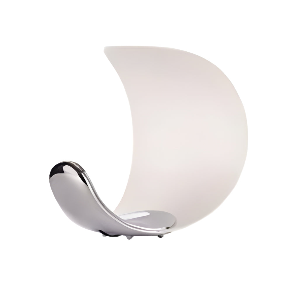 Curved silver end table lamp with a minimalist design, placed on a dark surface.