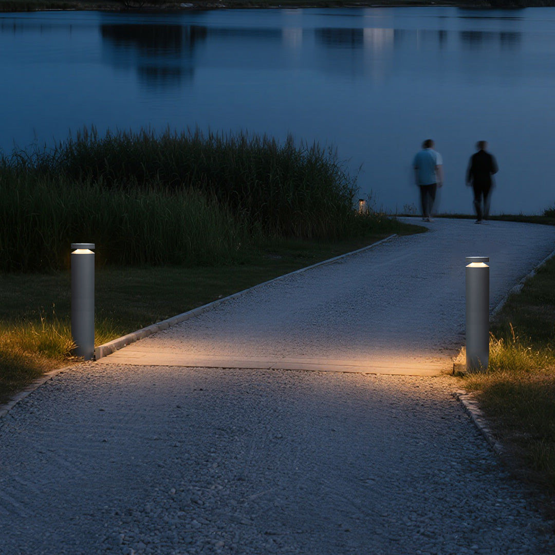 Pathway LED lights guiding pedestrians along curved walkway with contemporary urban lighting design