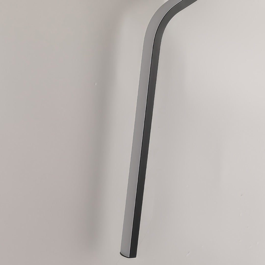 Curved wall sconce in modern design, featuring soft, indirect light that adds warmth and style to living spaces.