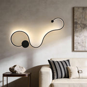 Curved wall sconce creating soft ambient lighting in a modern living room.