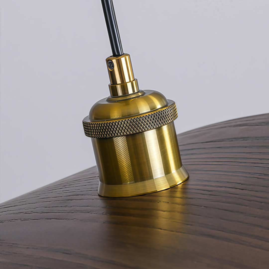 Close-up of a curved wood pendant light showcasing its wooden texture and warm glow.