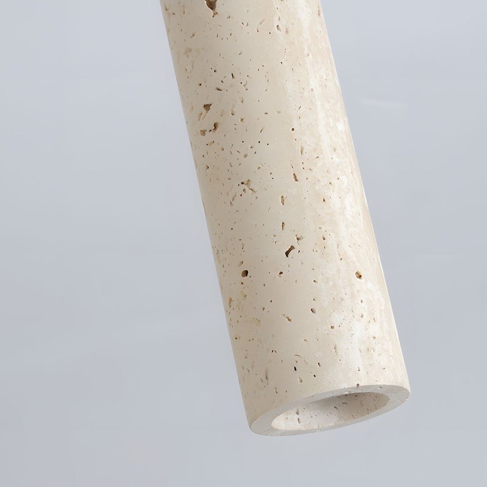 Cylinder downlight angled view, emphasizing its unique texture and warm light emission in a contemporary setting.