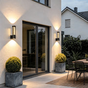 Black cylinder outdoor wall light