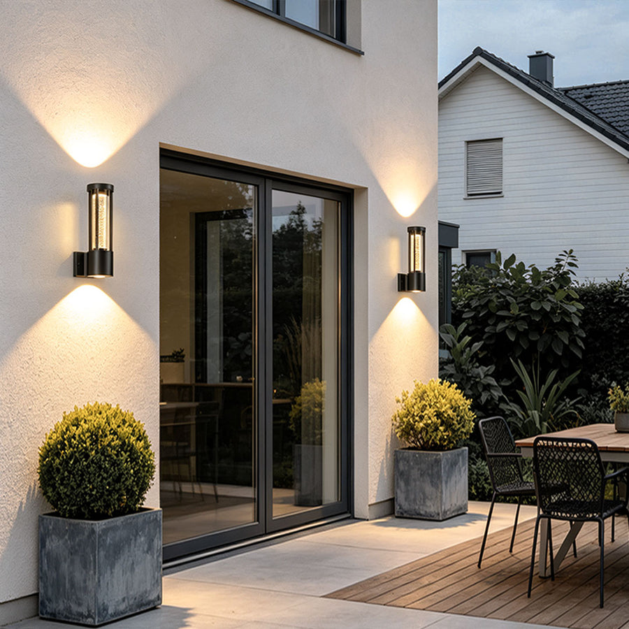 Black cylinder outdoor wall light