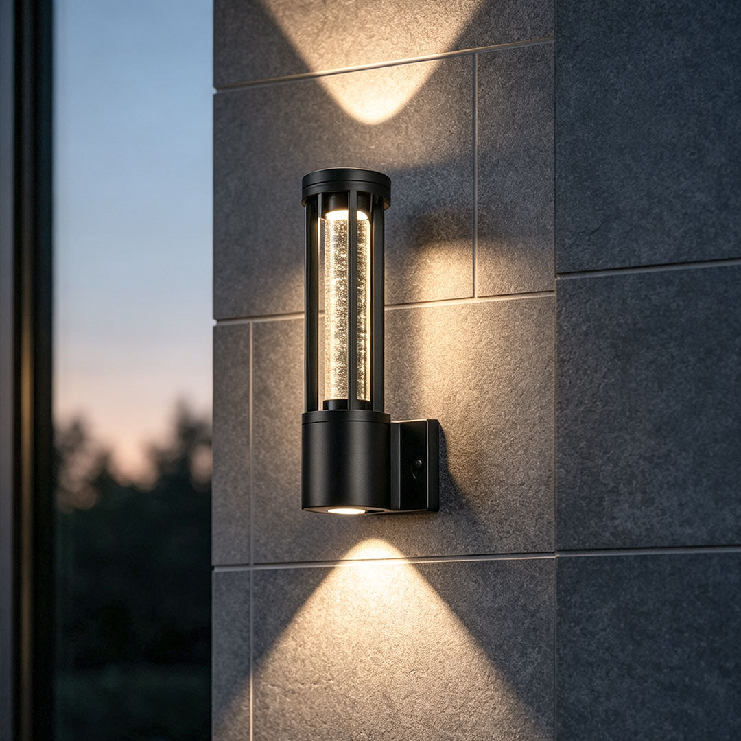 Black cylinder outdoor wall light