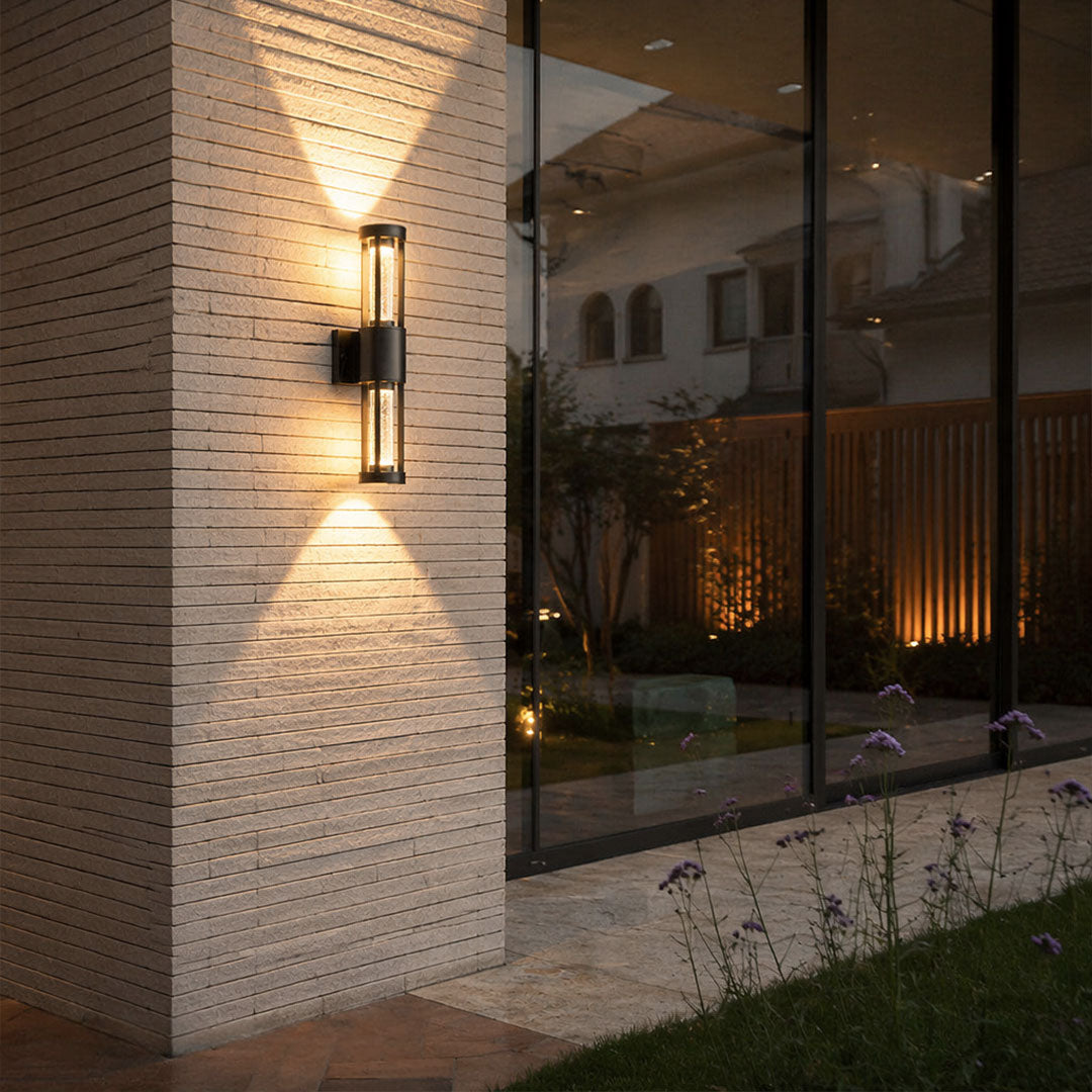Black cylinder outdoor wall light
