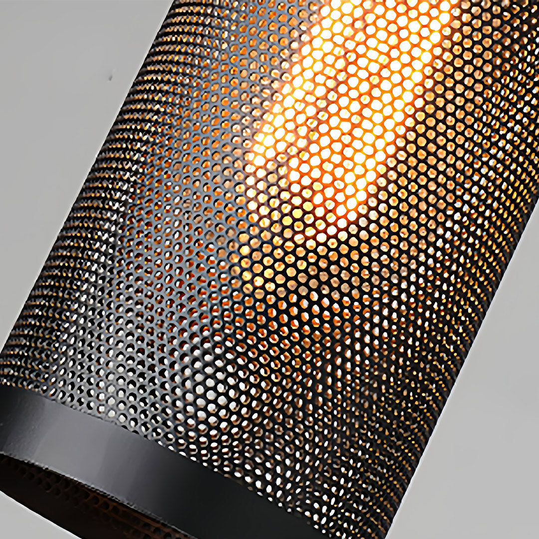 Detailed view of the cylinder retro industrial pendant lights with the warm filament of the vintage bulb showing through.