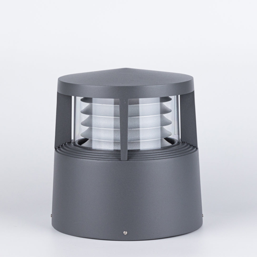 Minimalist cylindrical garden light with louvered diffuser against plain background
