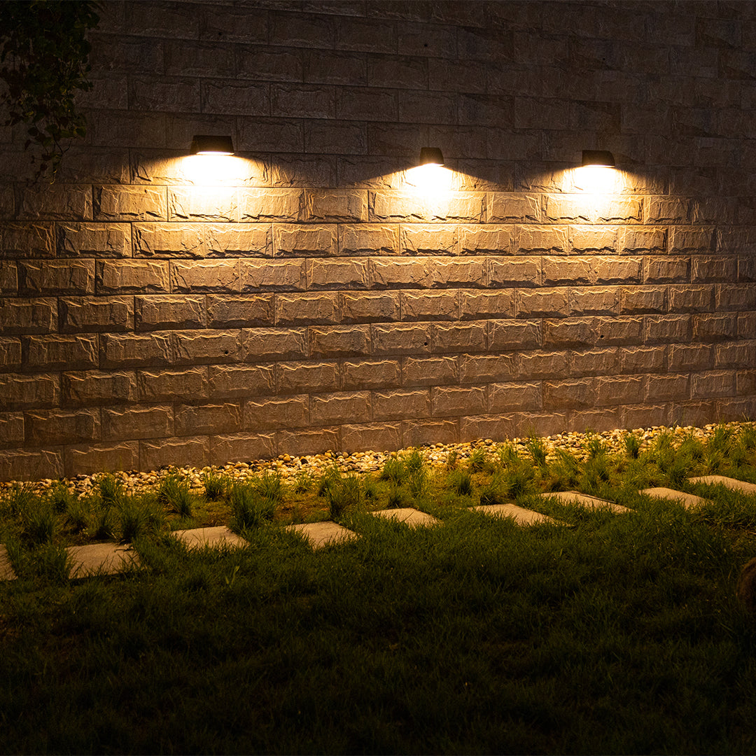 Rustic stone wall featuring warm LED accent lighting creating cozy atmospheric ambiance
