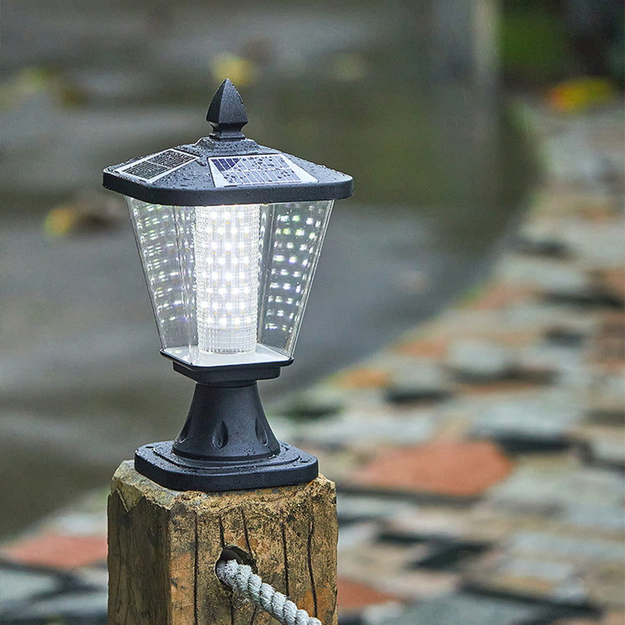 Elegant post cap light installed on stone pillar creating ambient outdoor illumination