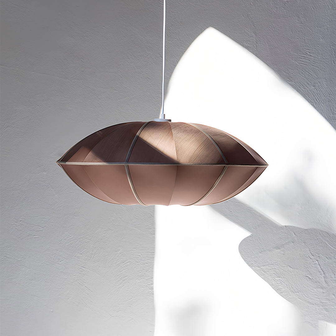 Dark fabric shade pendant light with contemporary design providing focused task lighting
